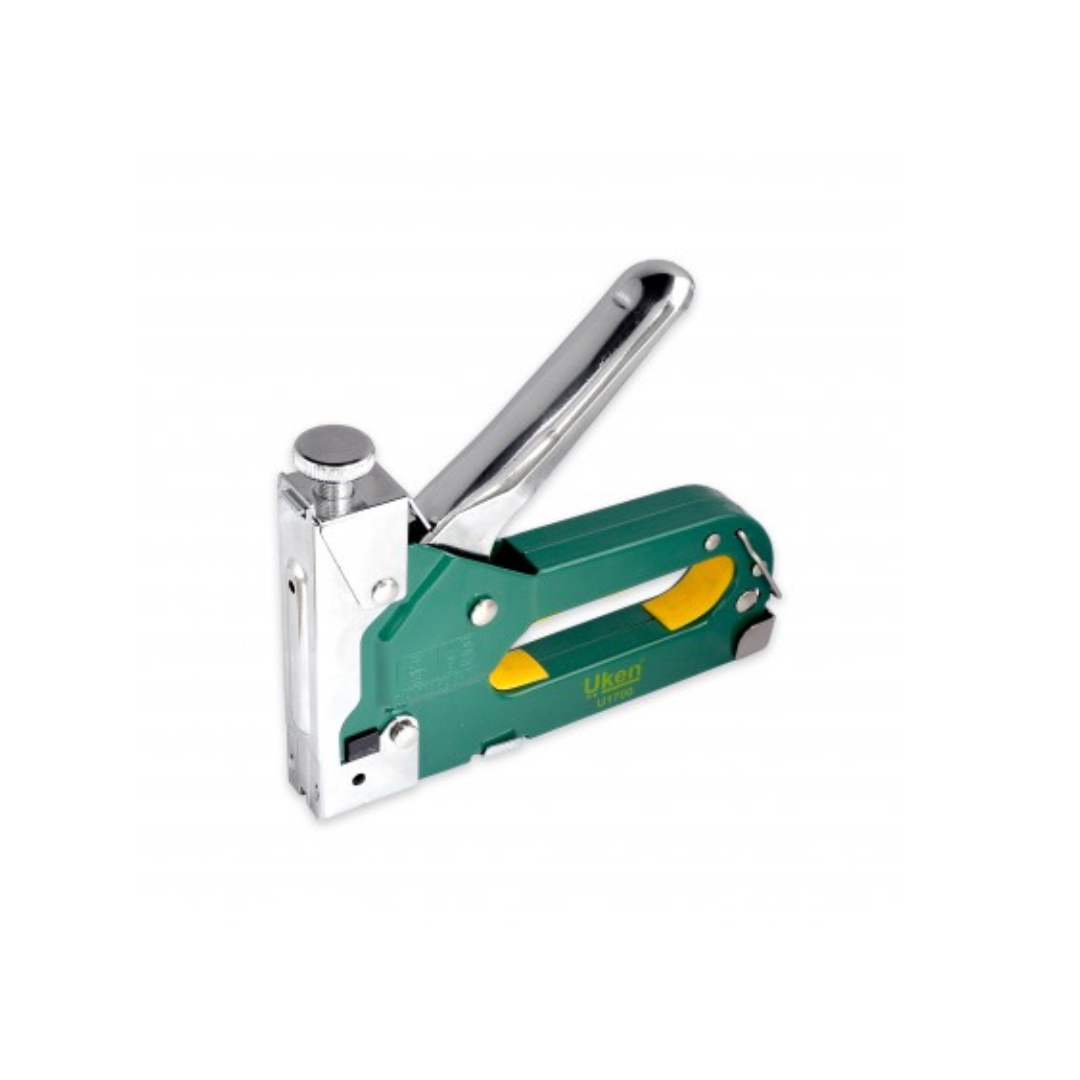 A manual staple gun with a green and silver color scheme, featuring a quick jam clear mechanism.