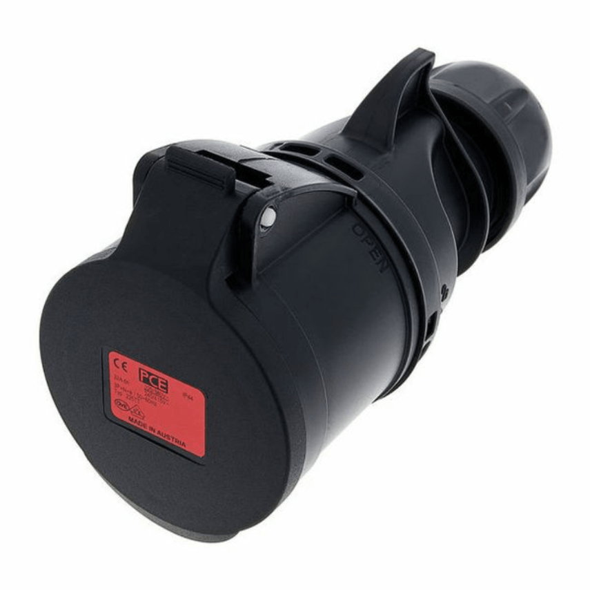 Black electrical plug with a red label on a white background