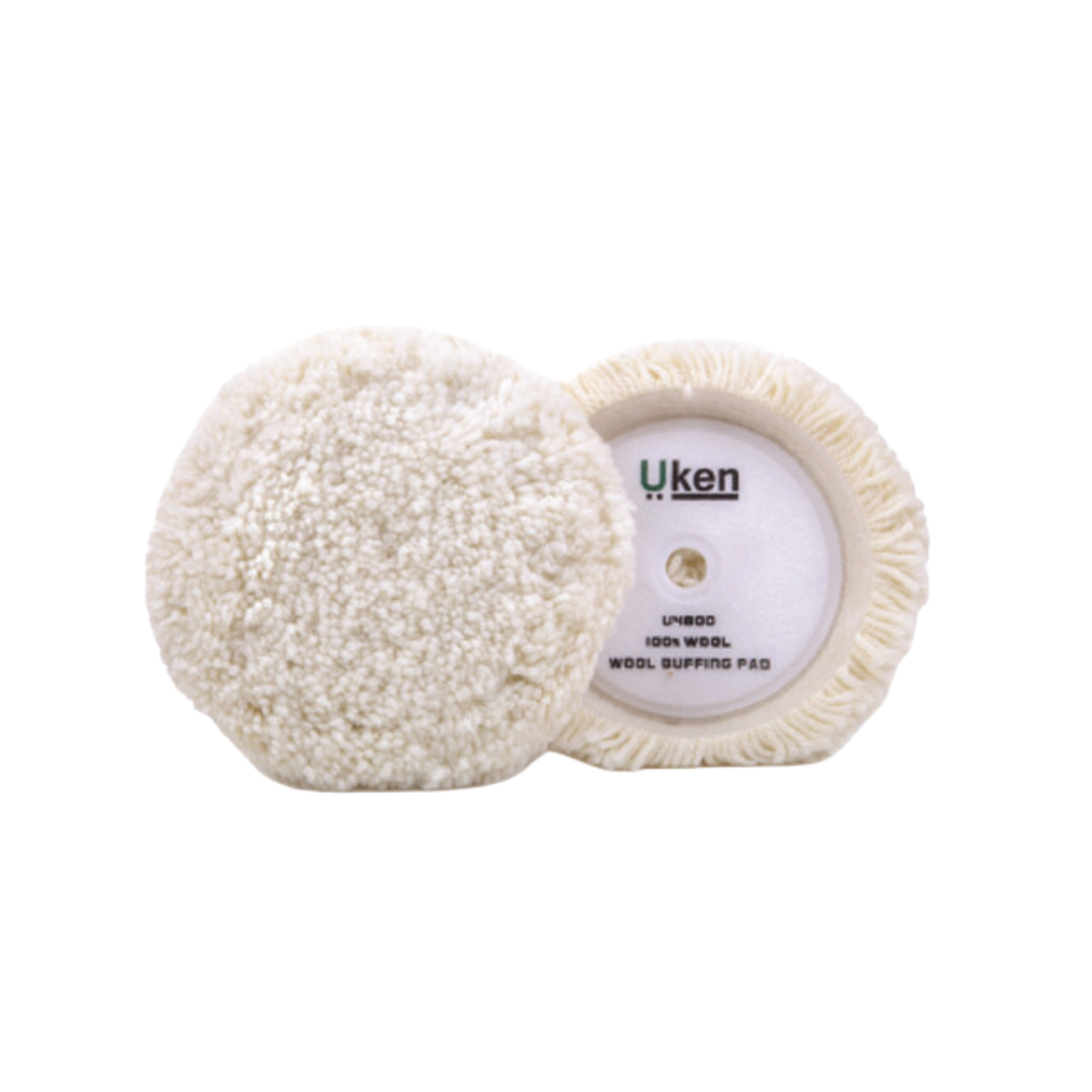 A beige wool bonnet designed for high gloss polish, showing both the flat and curved surfaces with the brand name 'Uken' visible on the label.